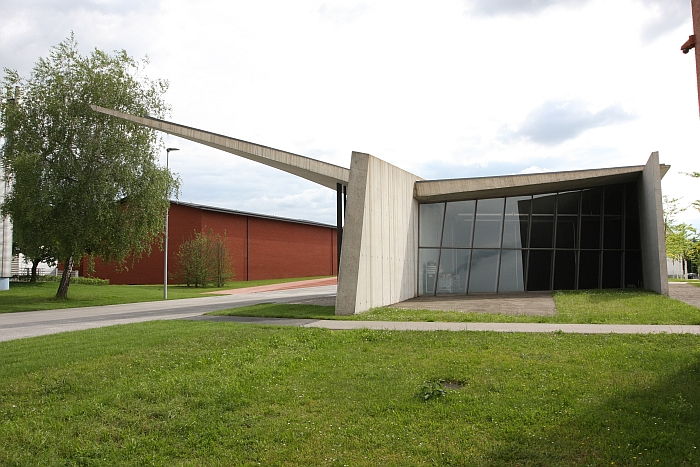The Vitra Fire Station holding a proterctive arm over the Vitra Schaudepot