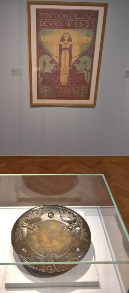 Plate with stag beetles by Johanna van Eybergen, and poster for the exhibition "De Vrouw" by Wilhelmina Drupsteen, as seen at Art Nouveau in Nederland, The Gemeentemuseum Den Haag