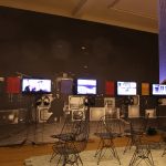 A collection of films, and Eames Wire Chairs, as seen at Together. The new architecture of the collective the Grassi Museum für Angewandte Kunst Leipzig