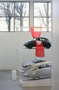 Design Mobilises with a VW Beetle, it's not that flag, but it should give the impression it is, as seen at Friedrich von Borries. Politics of Design. Design of Politics, Die Neue Sammlung Munich