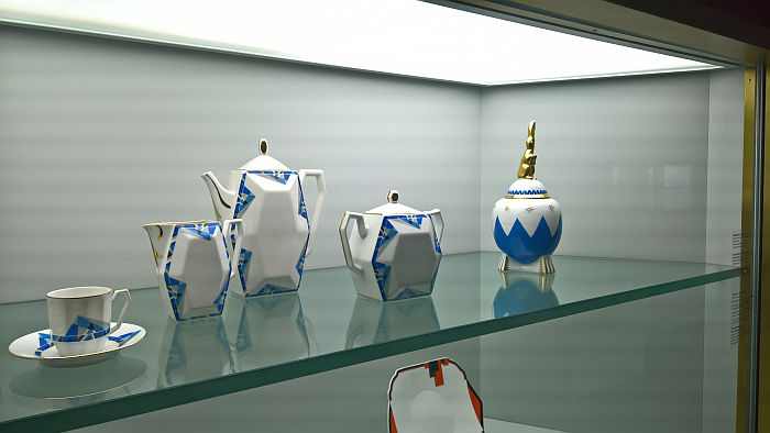 A coffee service from Union Limousine, Limoges and a monkey topped box from Ilse Pfeffer, Gotha, as seen at Spitzen des Art déco, Grassi Museum für Angewandte Kunst, Leipzig
