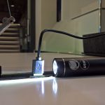 A rechargable USM bike light rechargig in a Haller E USB charger, as seen at USM Haller HomeWork, smow Cologne