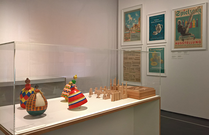 Spinning dolls by Ingeborg Schmidt (1957), an industrial facility playset by Ernst Rudolf Vogenauer (1949) and early 1950s gute Form posters, as seen at The Early Years. Mart Stam, the Institute and the Collection of Industrial Design, the Werkbundarchiv Museum der Dinge, Berlin
