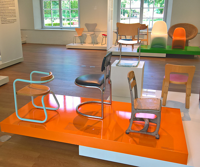 Metal children's chairs by Giuseppe Terragni, Ambrose Heal (attributed) and a works design by American Seating (left to right), as seen at Chairs. For children only!, Grassi Museum für Angewandte Kunst, Leipzig