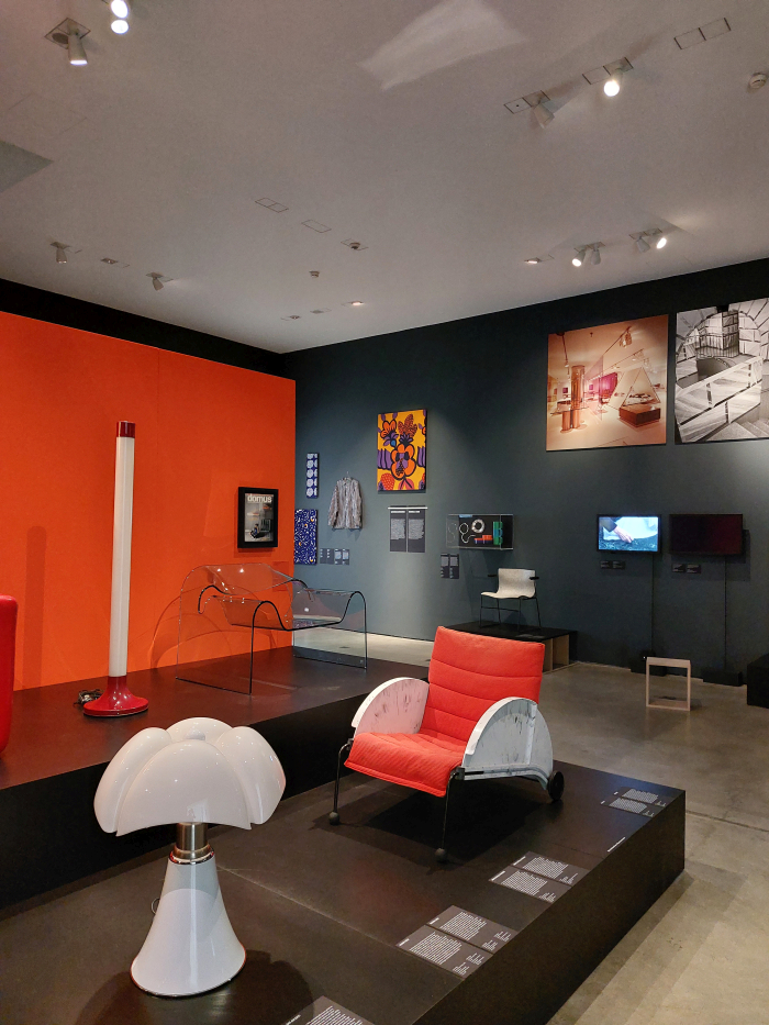 20th century works by, amongst others Gae Aulenti, Pipstrello lamp for Martinelli Luce (1965) (f. l.) & Anna Castelli Ferrieri, 4814 armchair for Kartell (1988) (r), as seen at Here We Are! Women in Design 1900 - Today, Vitra Design Museum, Weil am Rhein