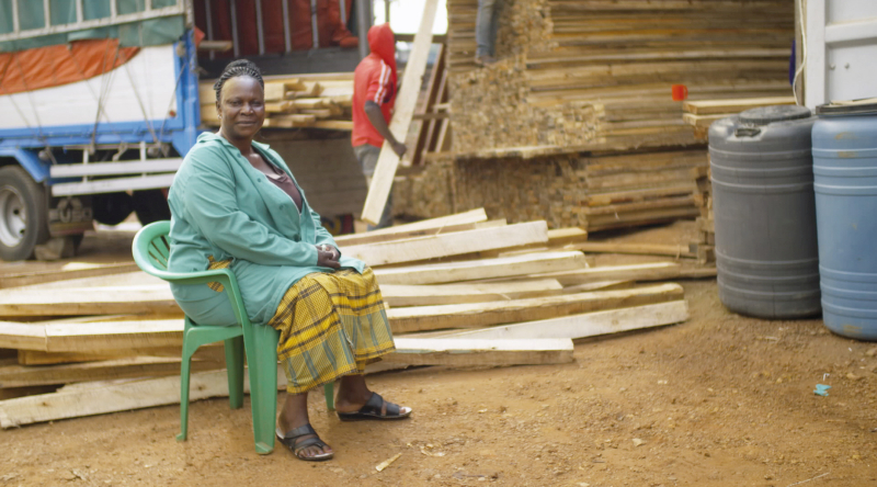 A timber dealer in Katende, Uganda. On a monobloc. (Photo © Boris Mahlau / PIER 53, courtesy Hatje Cantz)