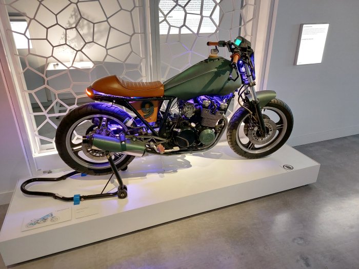 A motorbike with 3D printed components (the green bits), as seen at PRINT3D. Reprint Reality, CaixaForum, Sevilla