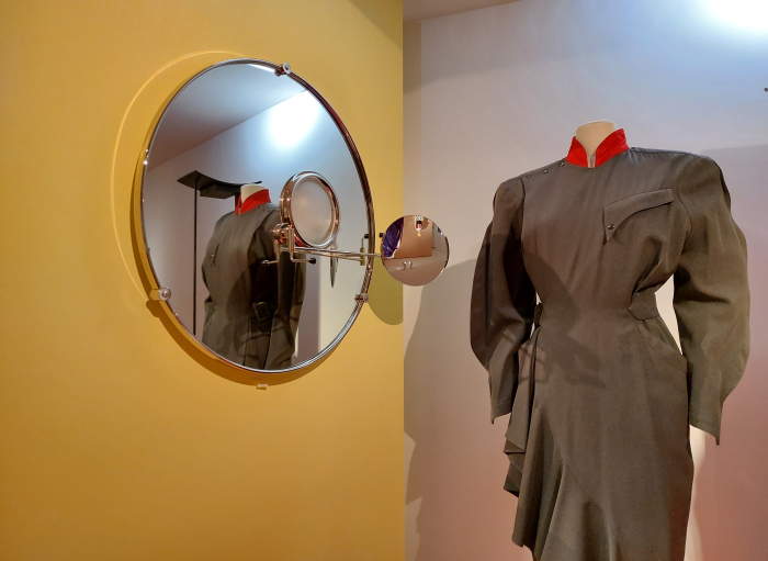 The mirror Satellite by Eileen Grey and a dress by Thierry Mugler, as seen at Années 80. Mode, design et graphisme en France, Musée des Arts décoratifs, Paris
