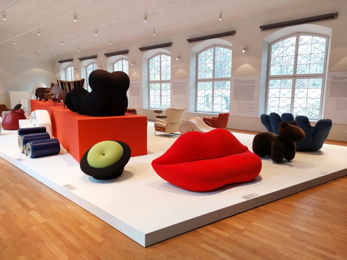 A collection of 1960s and 70s synthetic foam upholstery object including MAgriTTA by Roberto Matta and Bocca by Studio 65, as seen at Deep-seated. The Secret Art of Upholstery, Grassi Museum für Angewandte Kunst, Leipzig 