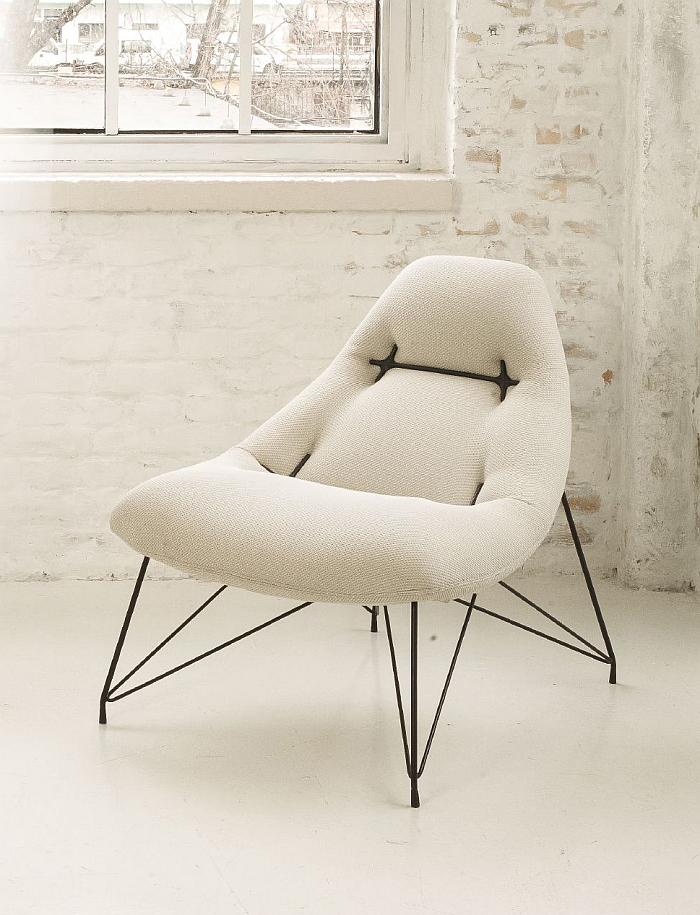 Peach easy chair by Annabella Hevesi / Line and Round.... The construction principle is inspired and informed by the anchor plates and tie rods traditionally emplyed to help provide stability to buildings, in this case they bring the 'flat' upholstery into shape and thus are decorative and structural....... (image Line and Round)