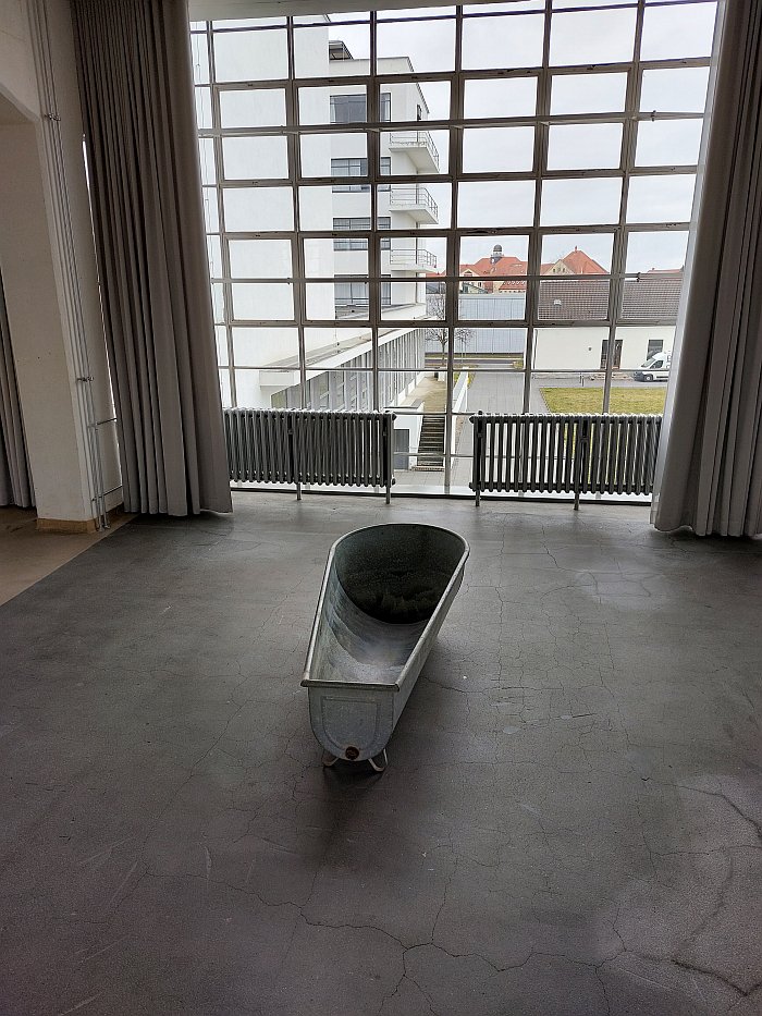 A 1920s zinc bath views the atelier building at Bauhaus Dessau, as seen at Kang Sunkoo - Sacristy, Stiftung Bauhaus Dessau