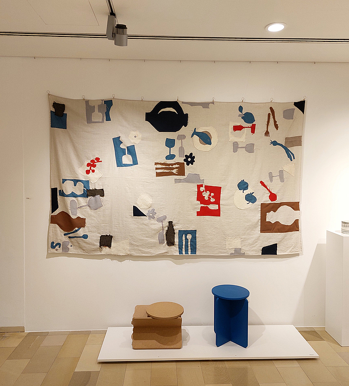 The XO stool/side table by Studio Sonntag and a tablecloth by Steffi Bauer, as seen at Tischkultur, Galerie Handwerk Munich, during Munich Creative Business Week 2025