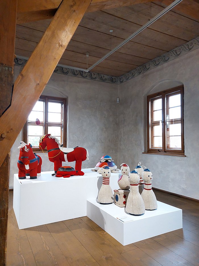 Rupfentiere from the Red Collection, and a game of skittles, as seen at Renate Müller Spielzeug + Design Sonneberg, Wasserschloß Klaffenbach, Chemnitz